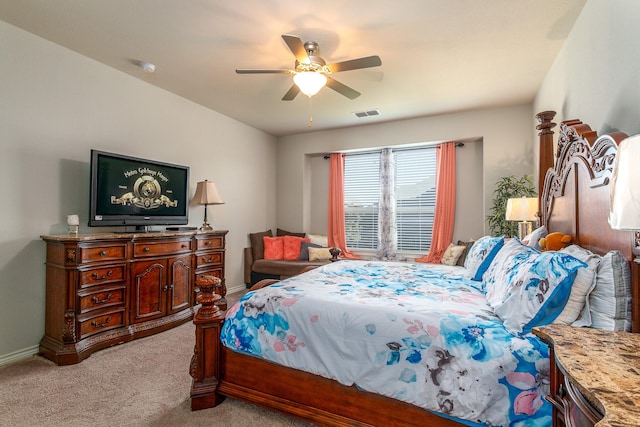 bedroom featuring visible vents, carpet floors, baseboards, and ceiling fan