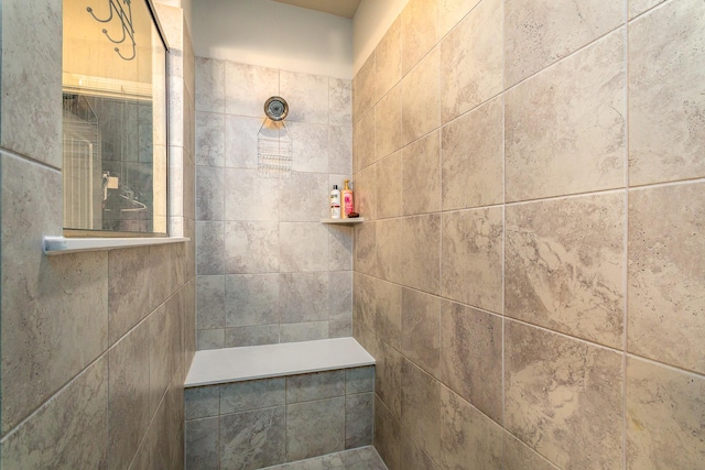 bathroom featuring tiled shower