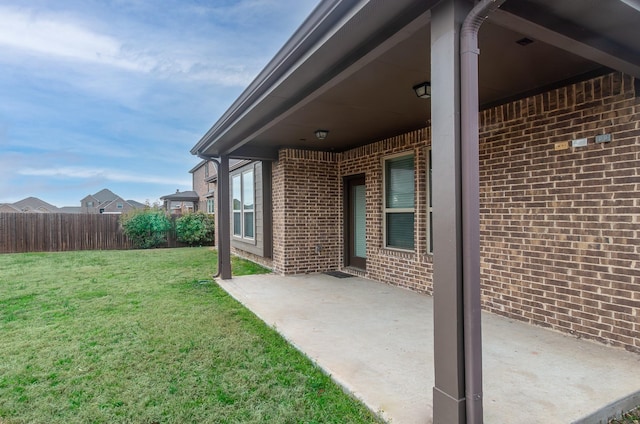 view of yard with fence and a patio area