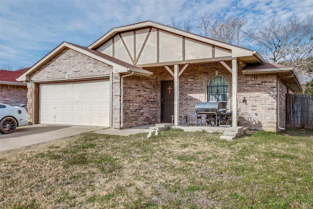 view of front of property featuring a garage and a front lawn