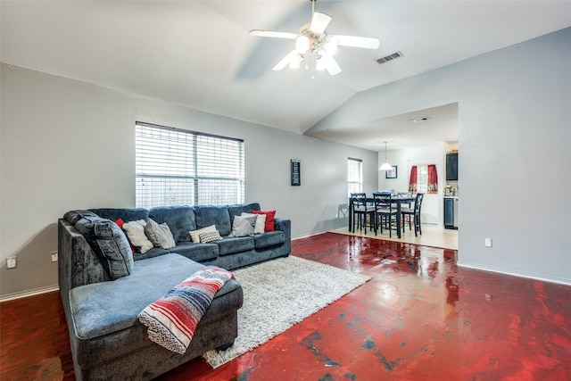 living room featuring ceiling fan and vaulted ceiling