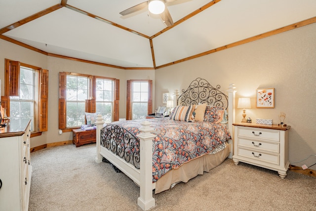 bedroom featuring lofted ceiling, crown molding, light carpet, and ceiling fan