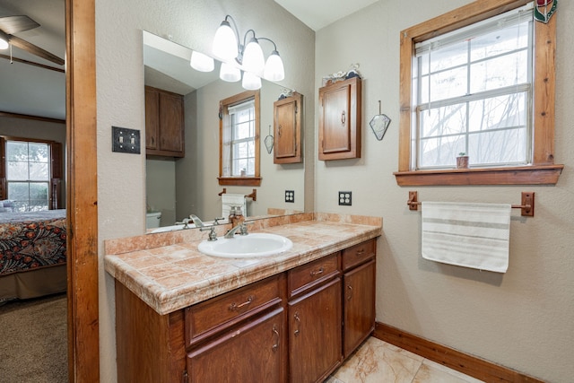 bathroom featuring vanity and toilet