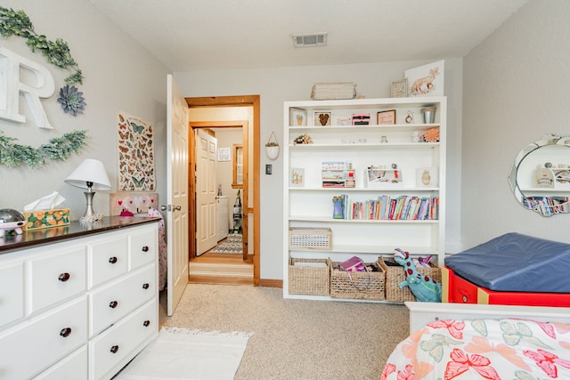 bedroom featuring light carpet