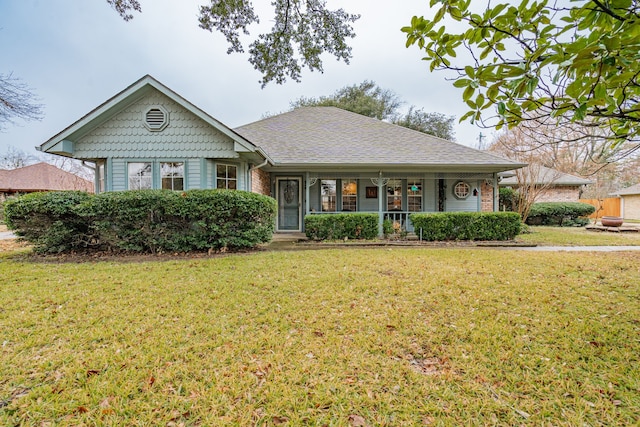 view of front of home featuring a porch and a front lawn