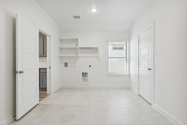 laundry area with gas dryer hookup, washer hookup, hookup for an electric dryer, and light tile patterned flooring