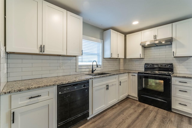 kitchen featuring white cabinetry, backsplash, sink, and black appliances