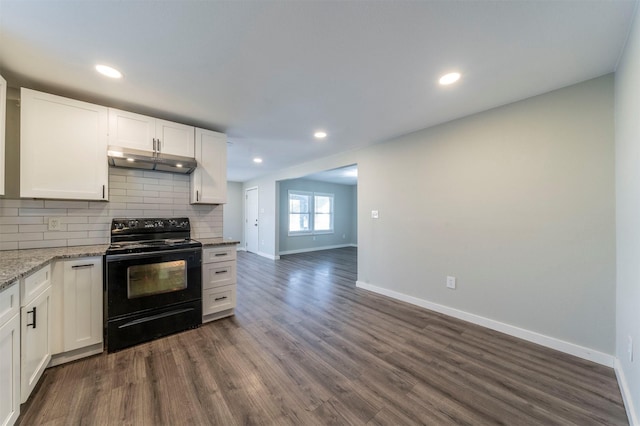 kitchen with white cabinetry, dark wood-type flooring, black electric range, and light stone countertops