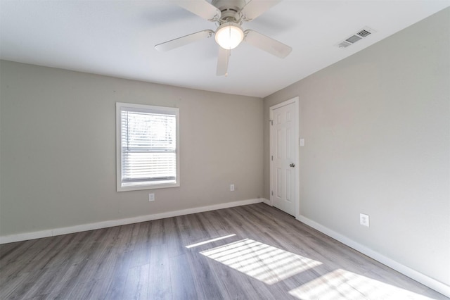 spare room with ceiling fan and light hardwood / wood-style floors