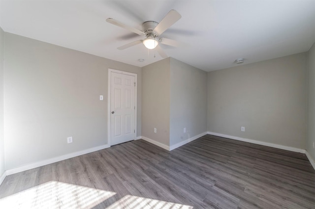 empty room featuring wood-type flooring and ceiling fan