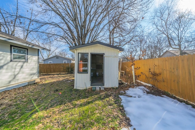 view of outbuilding featuring a lawn