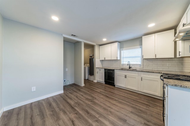 kitchen featuring sink, stainless steel gas stove, dark hardwood / wood-style floors, light stone counters, and white cabinets