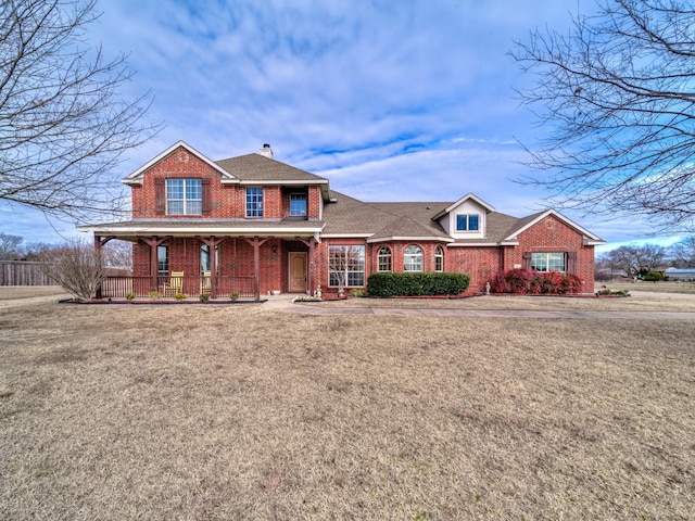 view of front of house featuring a porch and a front lawn