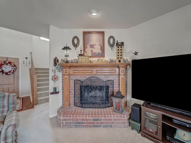 living room with carpet flooring and a fireplace