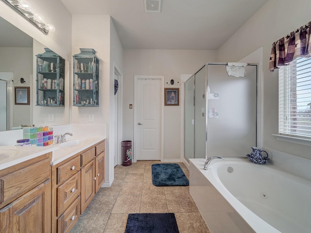 bathroom with vanity, plus walk in shower, and tile patterned flooring