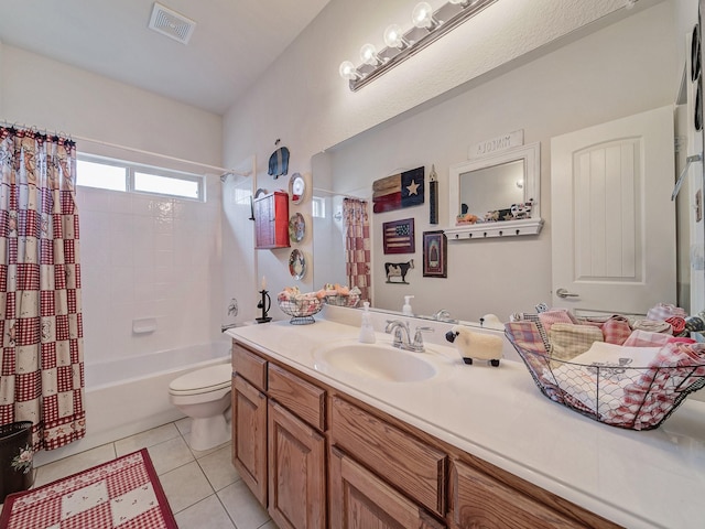 full bathroom with vanity, tile patterned floors, toilet, and shower / bath combo with shower curtain