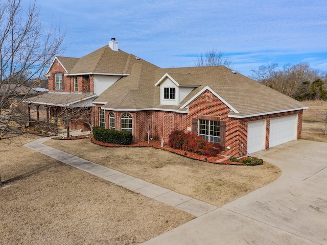 view of front facade with a garage and a front lawn