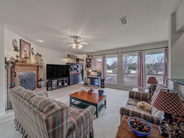 carpeted living room featuring ceiling fan