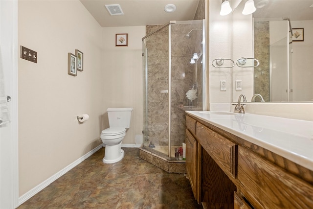 bathroom featuring a shower with door, vanity, and toilet