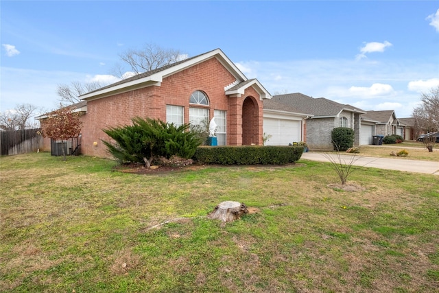 ranch-style house with a garage and a front yard