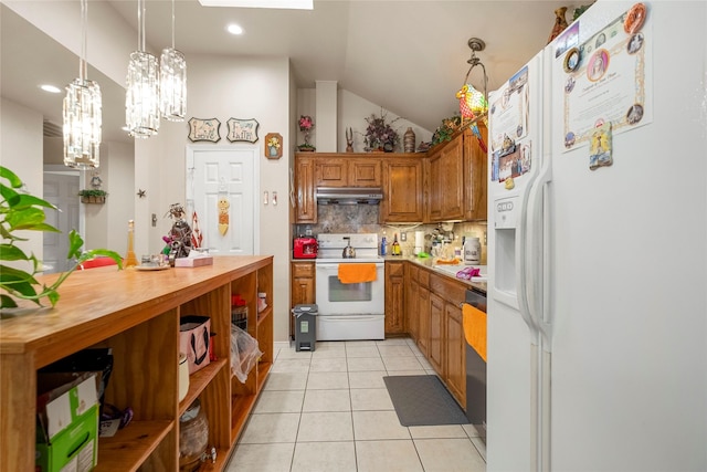 kitchen with lofted ceiling, light tile patterned floors, pendant lighting, white appliances, and decorative backsplash