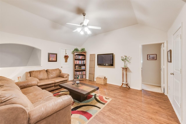 living room featuring lofted ceiling, light hardwood / wood-style flooring, and ceiling fan