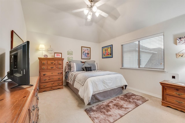 bedroom featuring vaulted ceiling, light colored carpet, and ceiling fan