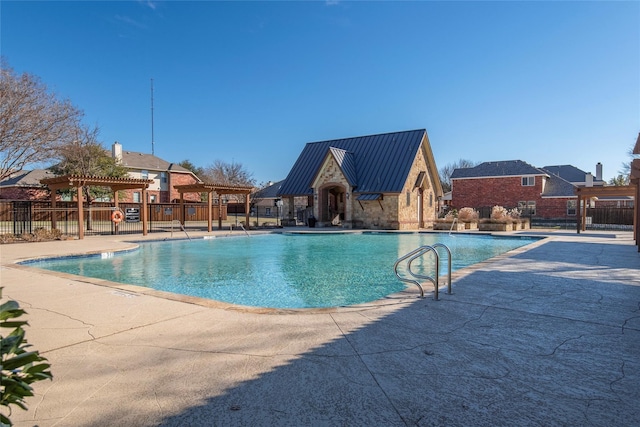 view of pool featuring a patio and a pergola