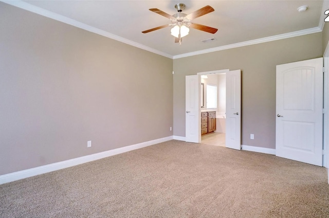 unfurnished bedroom featuring light colored carpet, ornamental molding, ceiling fan, and ensuite bathroom