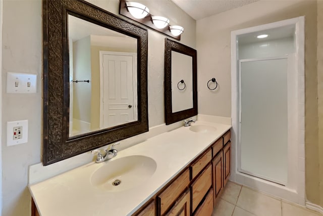 bathroom with tile patterned flooring and vanity