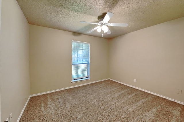 spare room featuring a textured ceiling, ceiling fan, and carpet flooring