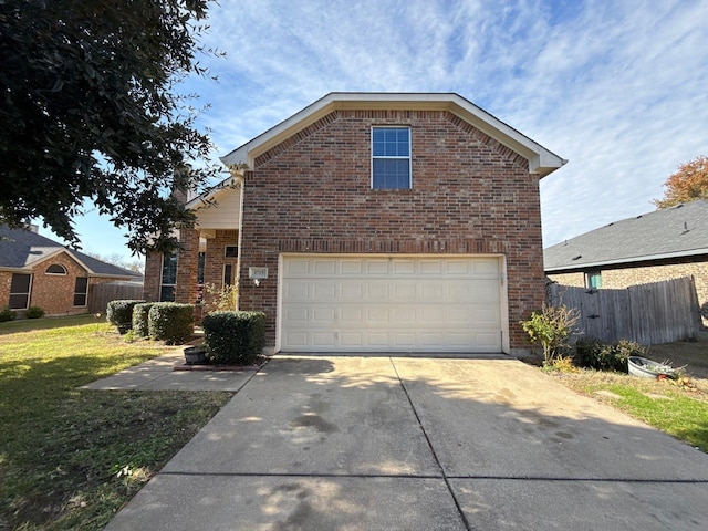 view of property with a garage and a front yard