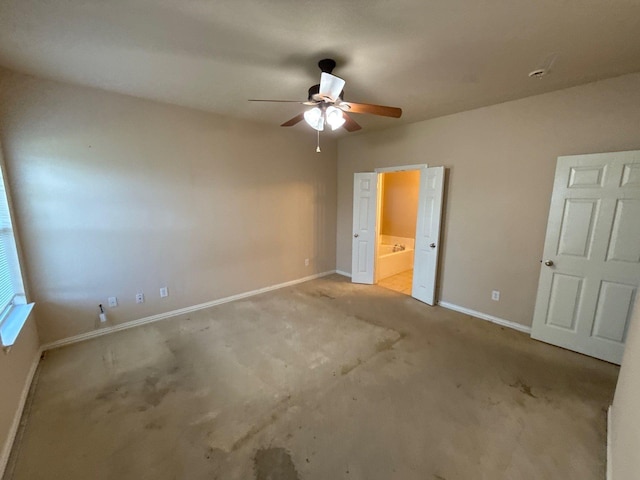 unfurnished bedroom with ceiling fan, light carpet, and ensuite bath