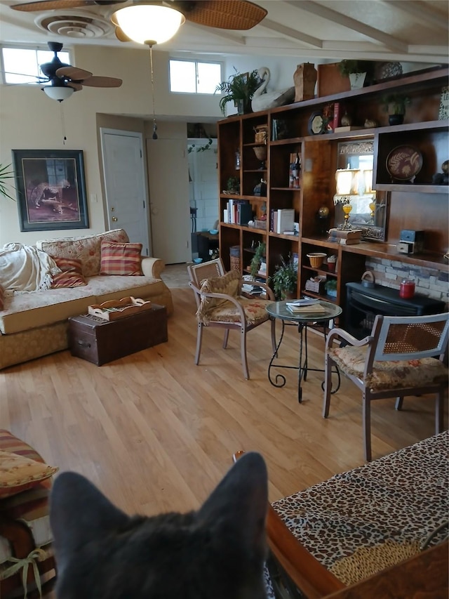 living room featuring ceiling fan and wood finished floors