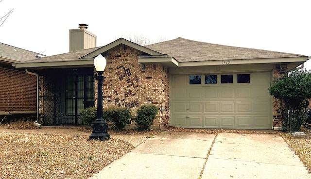 ranch-style home with a garage