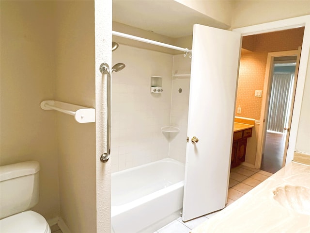 full bathroom with tile patterned flooring, vanity, shower / tub combination, and toilet