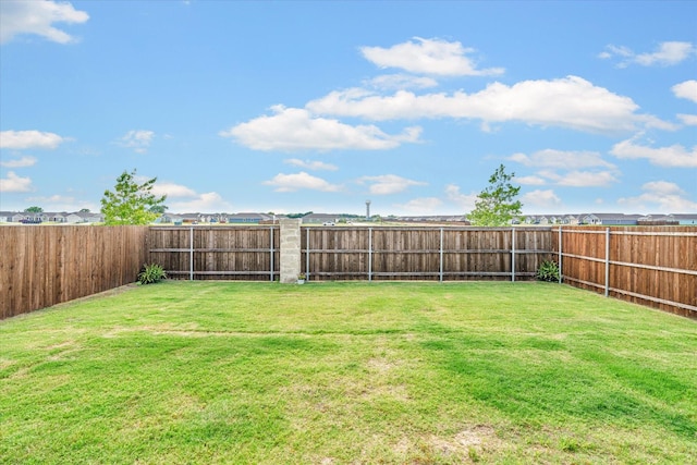 view of yard featuring a fenced backyard