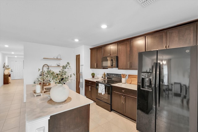 kitchen with light countertops, dark brown cabinetry, black appliances, and open shelves