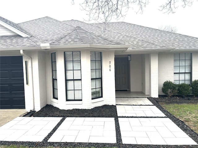 property entrance with a garage