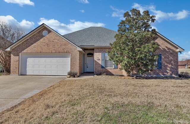 view of front of house featuring a garage, a front yard, and french doors