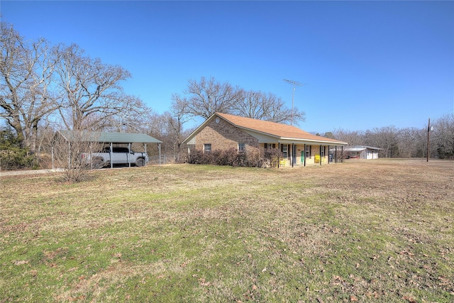 exterior space with a front yard and a carport