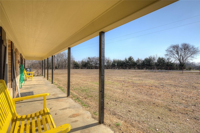 view of yard featuring a patio and a rural view