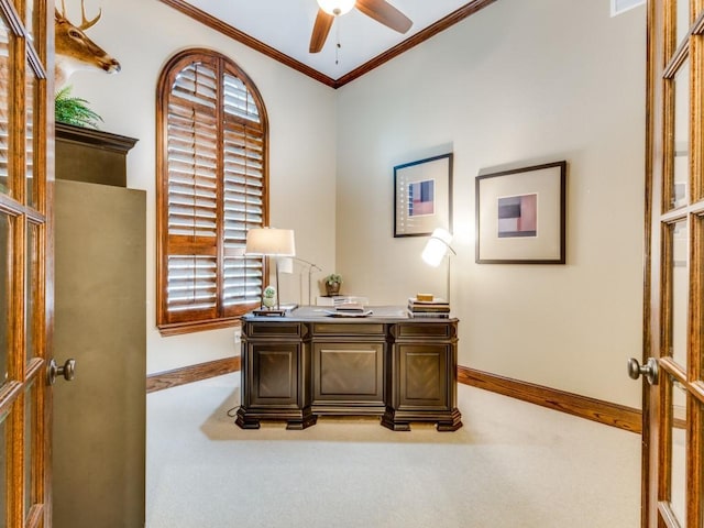 carpeted office with ornamental molding and ceiling fan