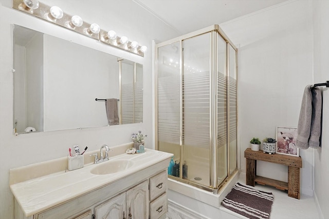 bathroom featuring vanity and a shower with door