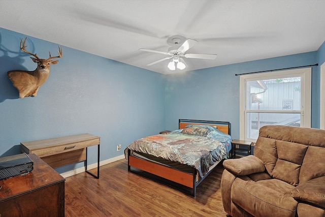 bedroom with wood-type flooring and ceiling fan