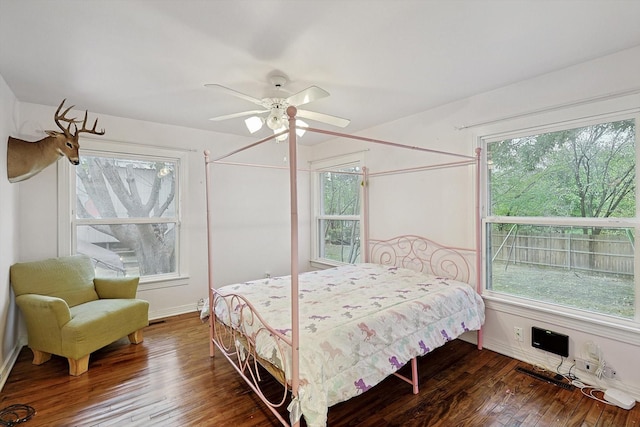 bedroom featuring dark hardwood / wood-style flooring and ceiling fan