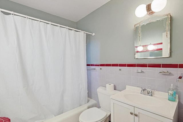 full bathroom featuring vanity, shower / tub combo, and toilet