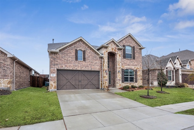 view of property featuring a garage and a front yard