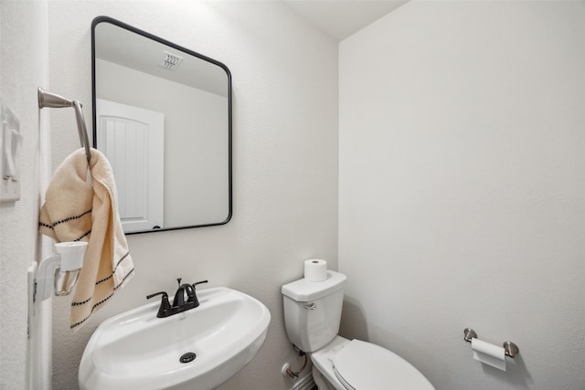 bathroom featuring sink and toilet