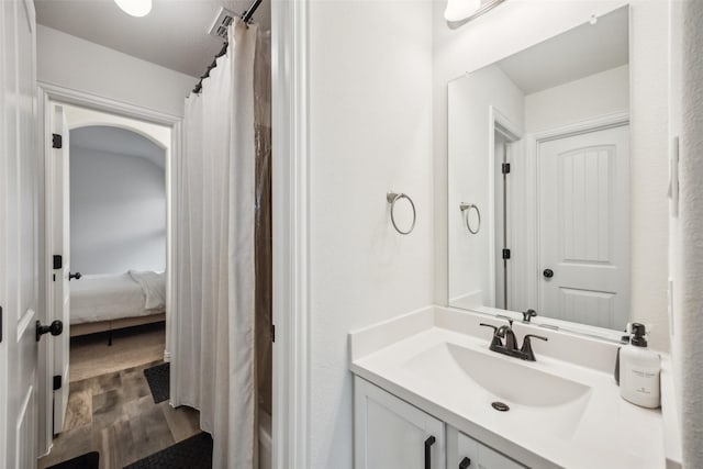 bathroom with vanity and hardwood / wood-style floors